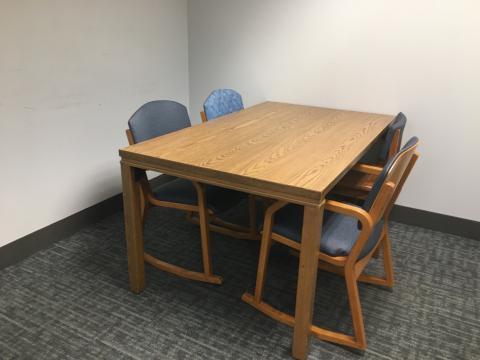 room with table and four chairs