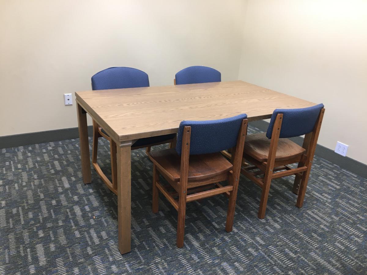 room with table and four chairs