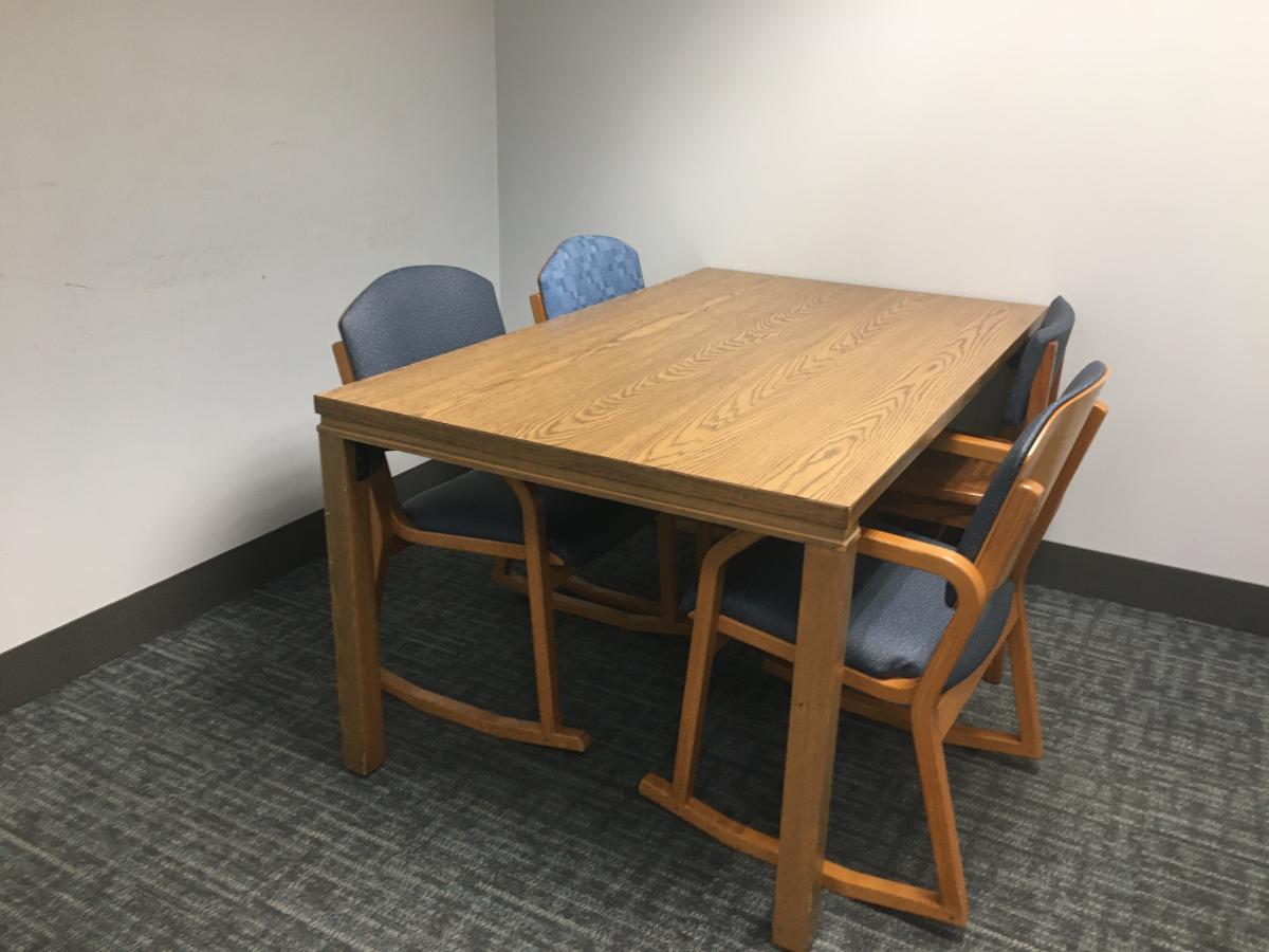 room with table and four chairs